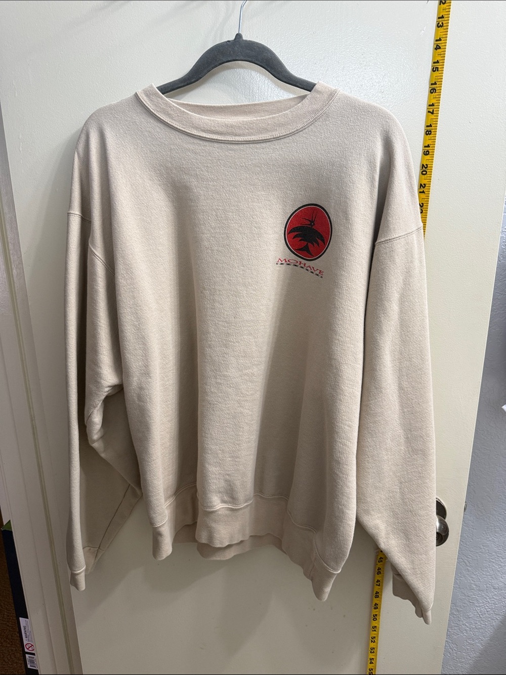Popular Basics Cream Crewneck Sweatshirt with Red Crest Mohave symbol.